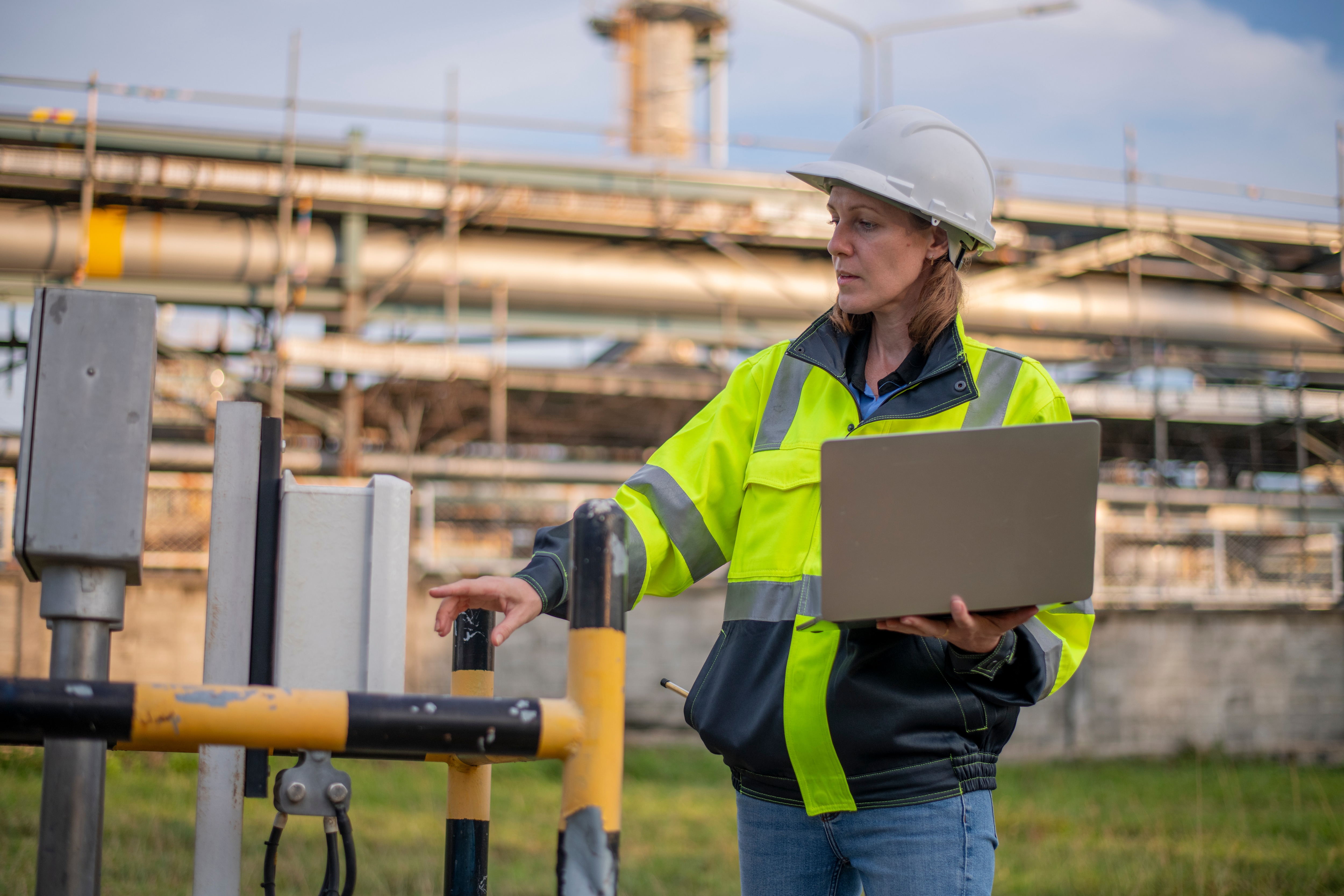 female-engineer-inspecting-industrial-infrastructure